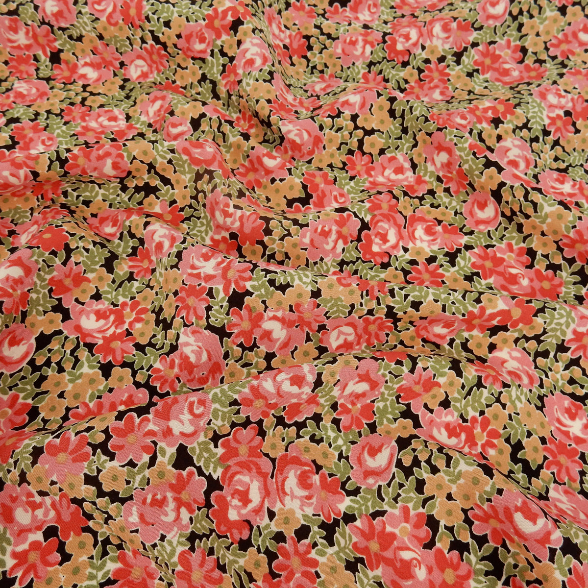 Premium 100% Rayon Challis Fabric.  Rose & Sage Millefleurs Floral on Black. lightweight & ultra soft. shown lightly gathered