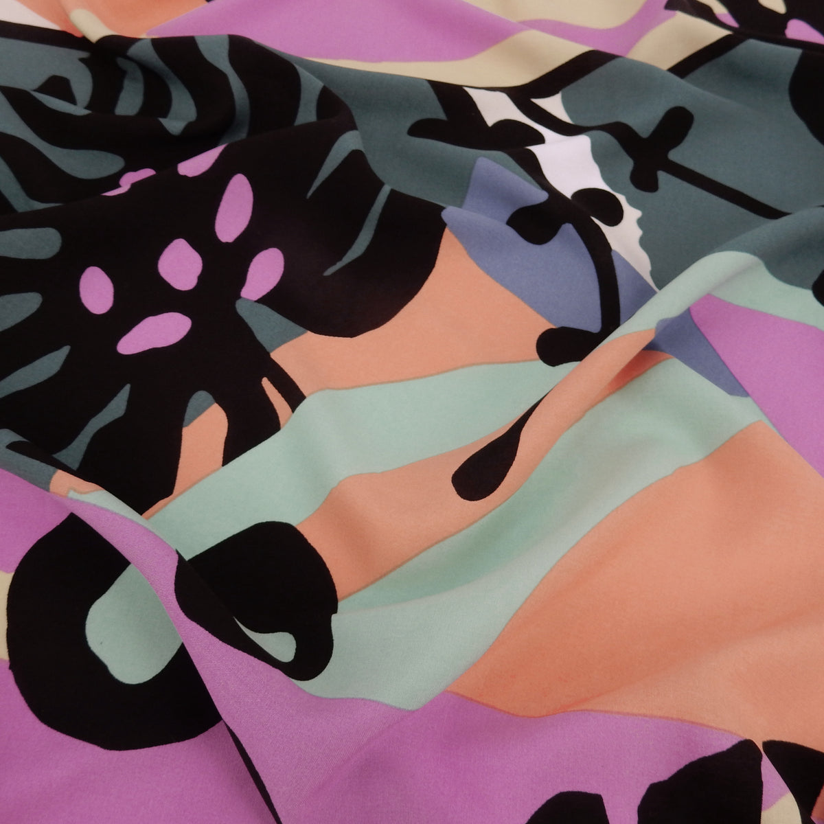 Premium 100% Rayon Challis Fabric. Retro Modern Abstract Graphic in Black, White & Fuschia. lightweight & ultra soft. shown lightly gathered