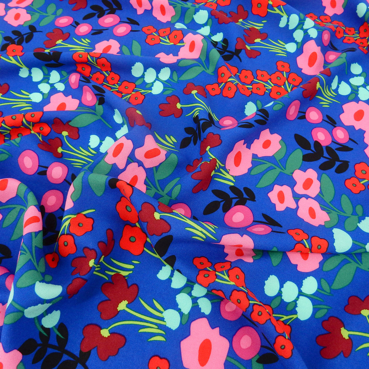 Premium 100% Rayon Challis Fabric. Bold Renaissance Floral on Sapphire Blue. lightweight & ultra soft. shown lightly gathered