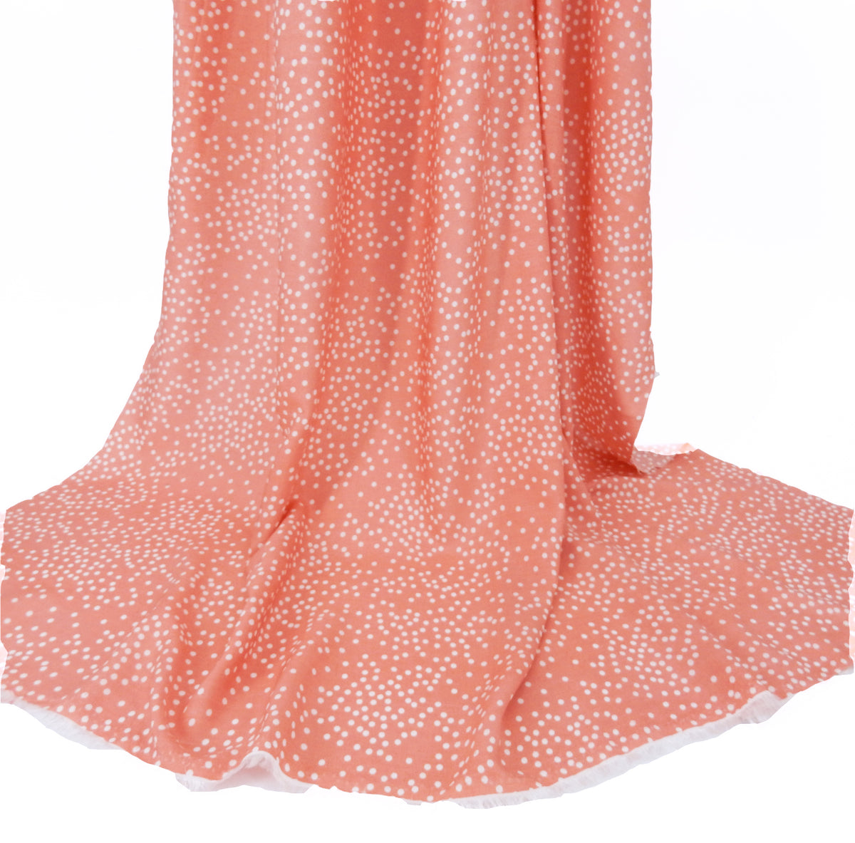 Premium 100% Rayon Challis Fabric. Artfully Spaced Polka Dot on Soft Coral. lightweight & ultra soft. shown draped