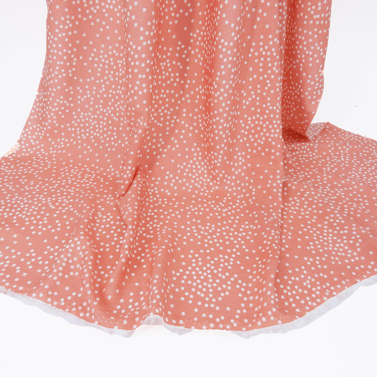 Premium 100% Rayon Challis Fabric. Artfully Spaced Polka Dot on Soft Coral. lightweight & ultra soft. shown draped