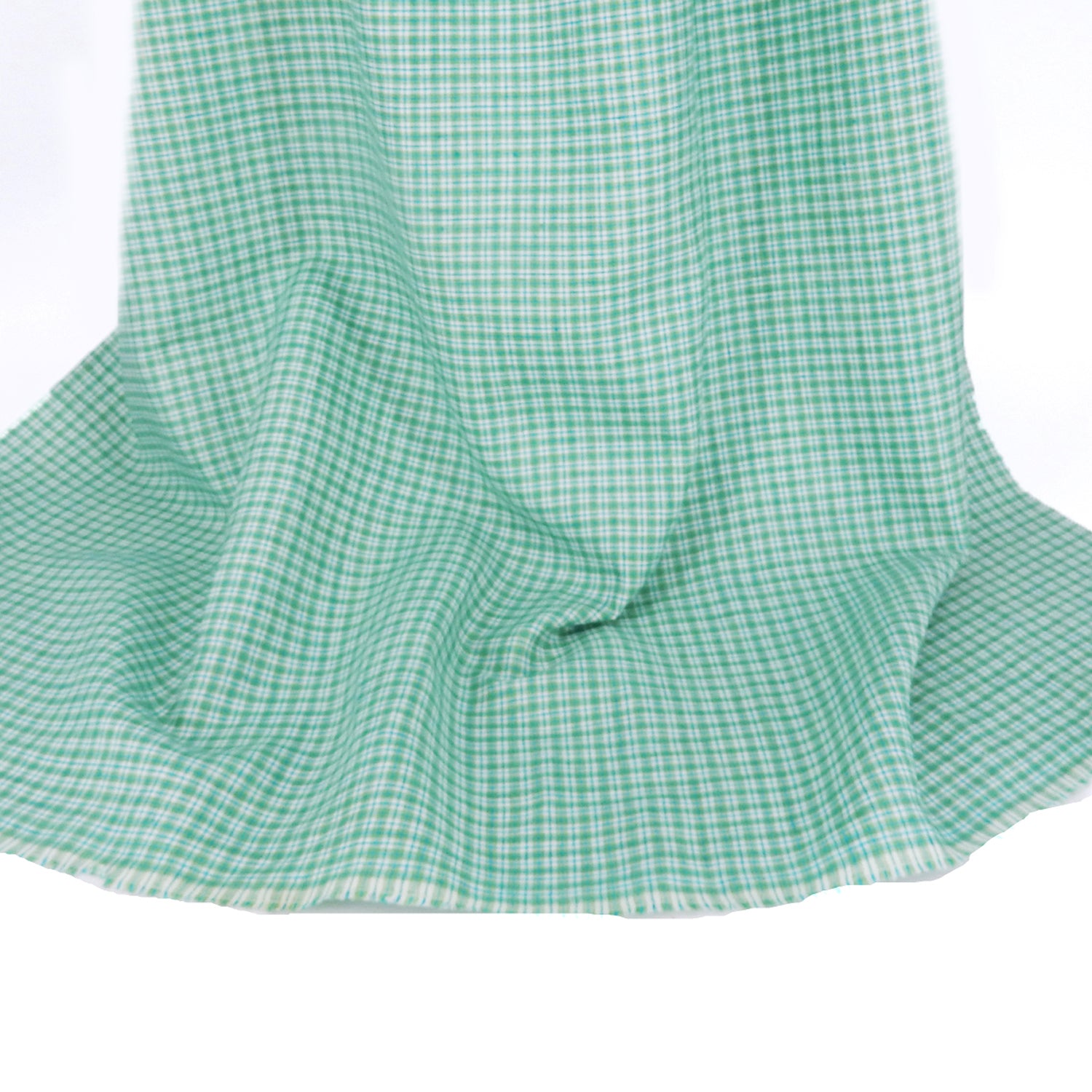 Premium 100% European Linen Yarn Dyed Plaid Fabric. light green color. shown draped