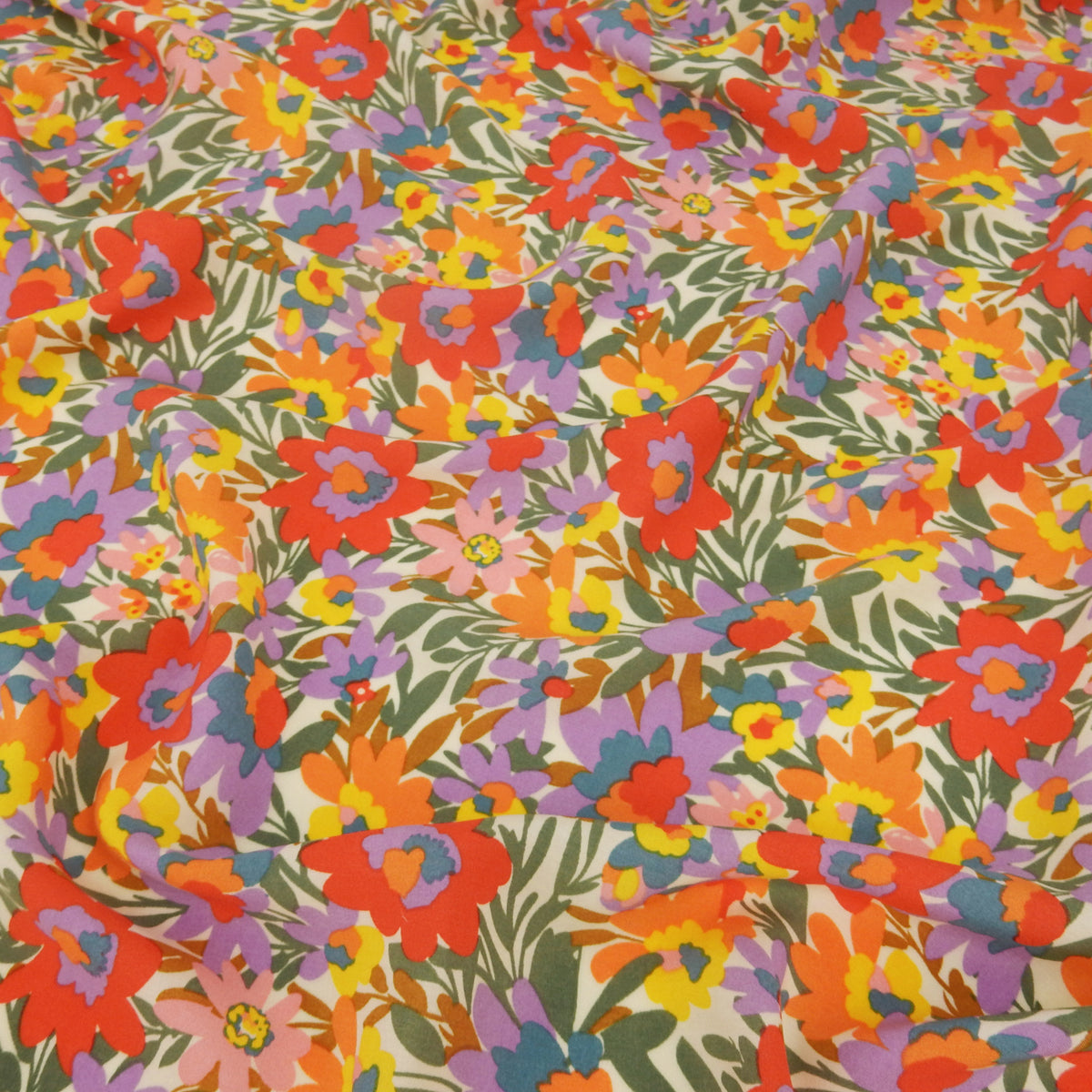 Premium 100% Rayon Challis Fabric. High-Contrast Soft Muted Floral on Creamy White. lightweight & ultra soft. shown lightly gathered