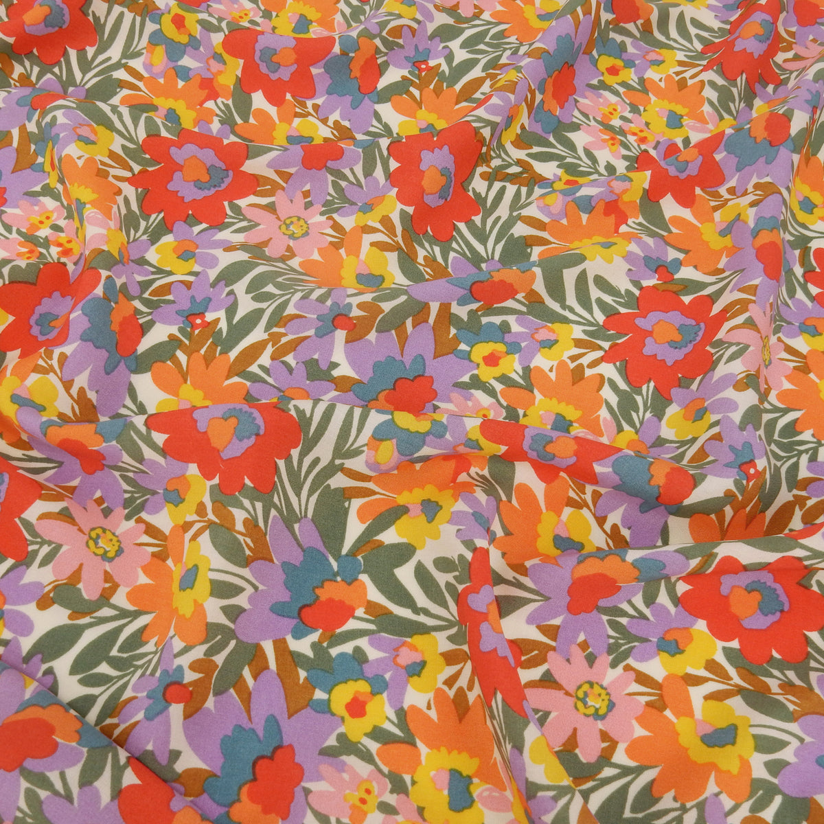 Premium 100% Rayon Challis Fabric. High-Contrast Soft Muted Floral on Creamy White. lightweight & ultra soft. shown lightly gathered