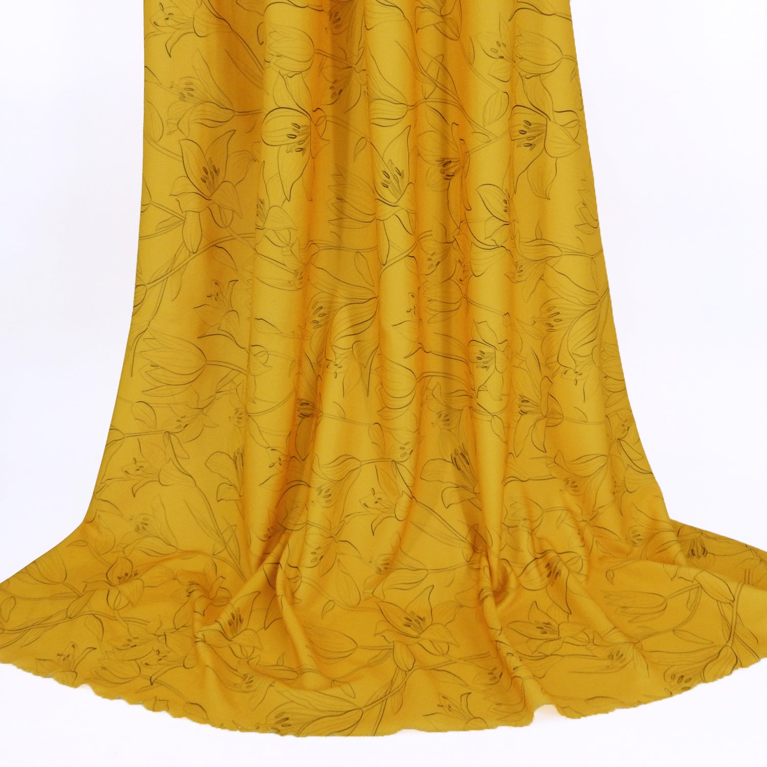 Premium Pebble Crepe Double Stretch Knit Fabric.  Lily floral design on rich gold 2-way stretch polyester crepe. shown draped