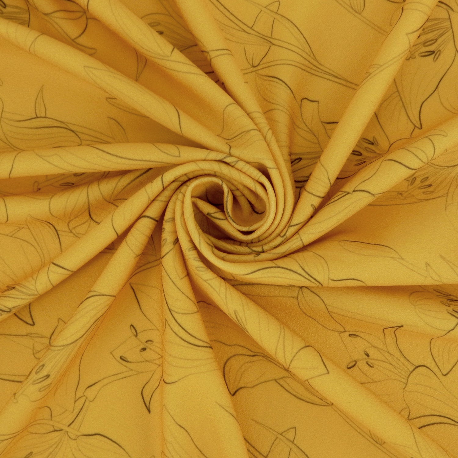 Premium Pebble Crepe Double Stretch Knit Fabric.  Lily floral design on rich gold 2-way stretch polyester crepe. shown swirled
