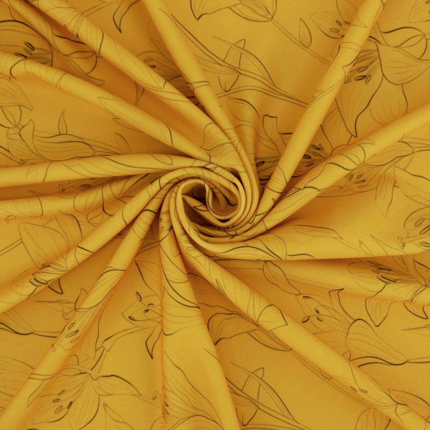Premium Pebble Crepe Double Stretch Knit Fabric.  Lily floral design on rich gold 2-way stretch polyester crepe. shown swirled