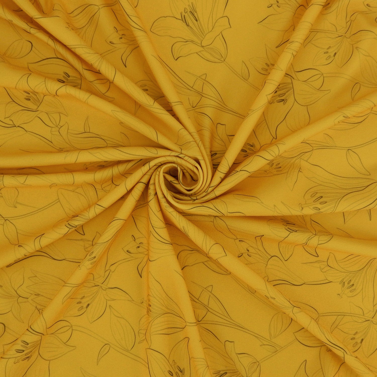 Premium Pebble Crepe Double Stretch Knit Fabric.  Lily floral design on rich gold 2-way stretch polyester crepe. shown swirled