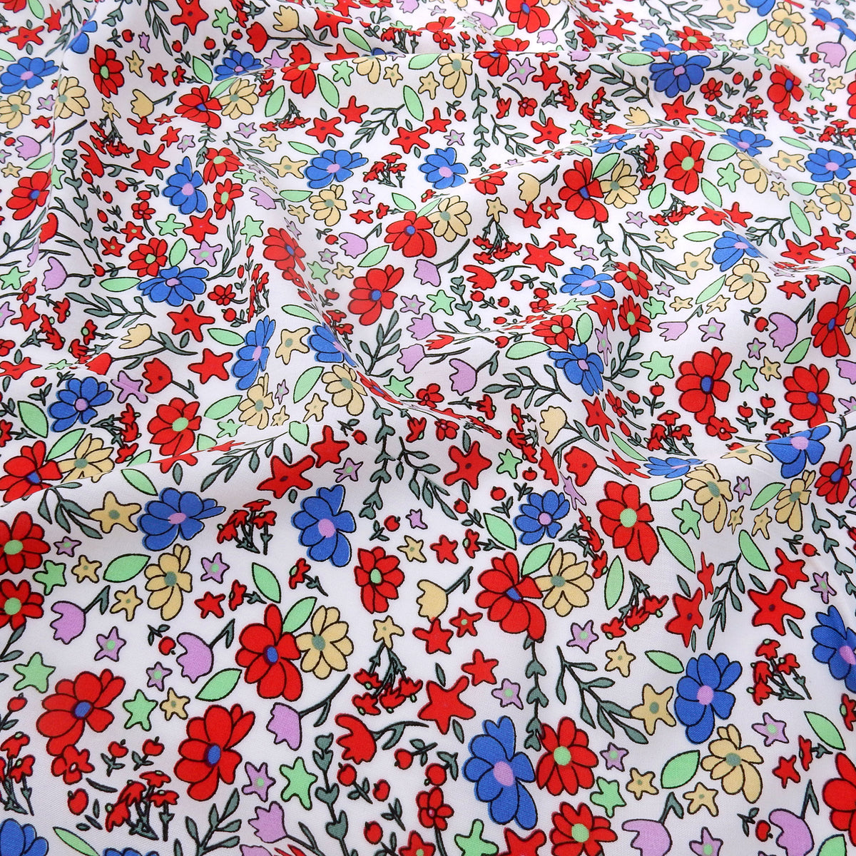 Premium 100% Rayon Challis Fabric. Playful Millefleurs Floral in Red, Periwinkle, Soft Yellow, Lilac & Mint. lightweight & ultra soft. shown lightly gathered