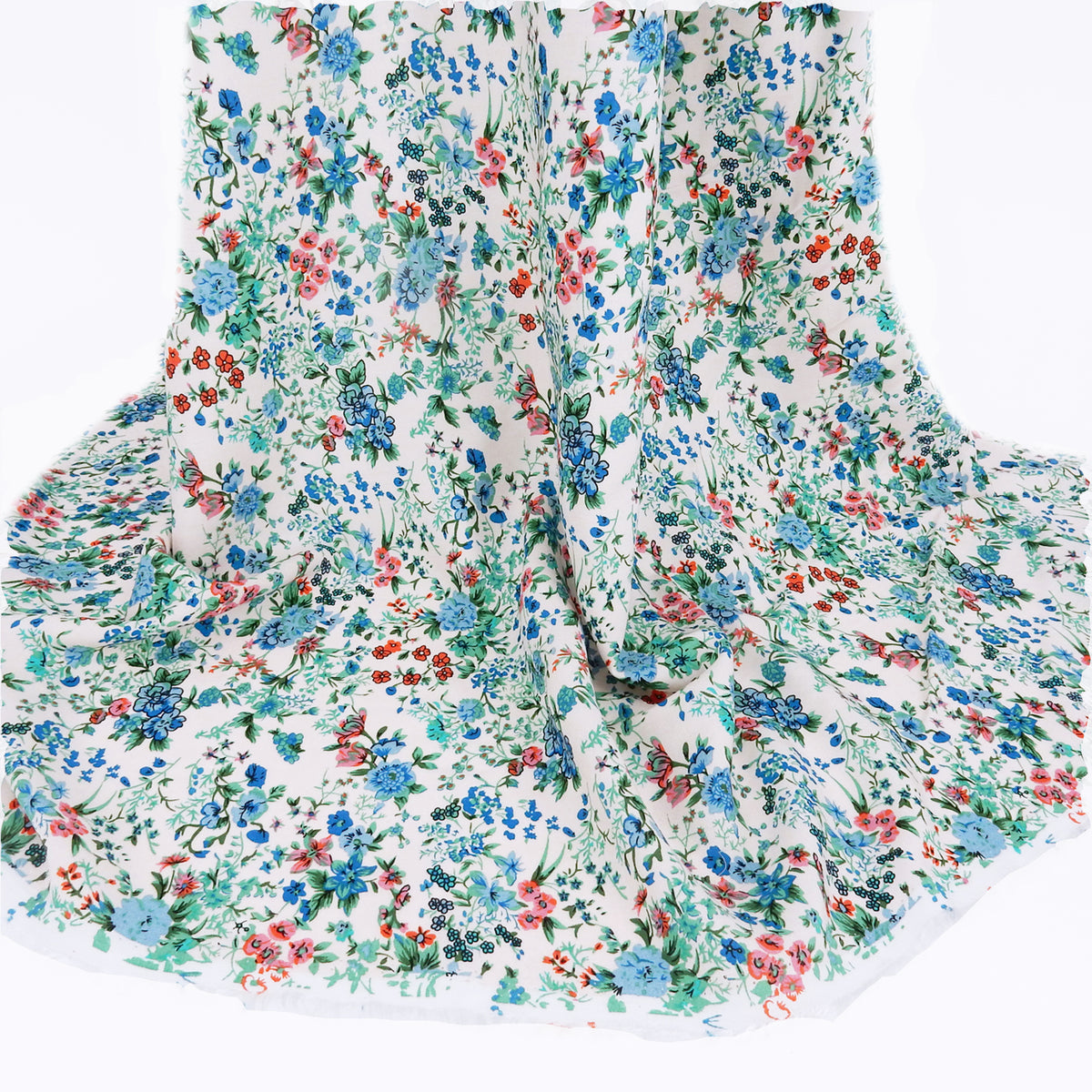Premium 100% Rayon Challis Fabric. Playful Millefleurs Floral in Sky Blue, Terracotta, Royal Blue on Cream lightweight & ultra soft. shown draped