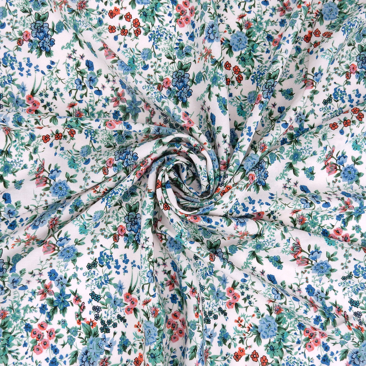 Premium 100% Rayon Challis Fabric. Playful Millefleurs Floral in Sky Blue, Terracotta, Royal Blue on Cream lightweight & ultra soft. shown swirled