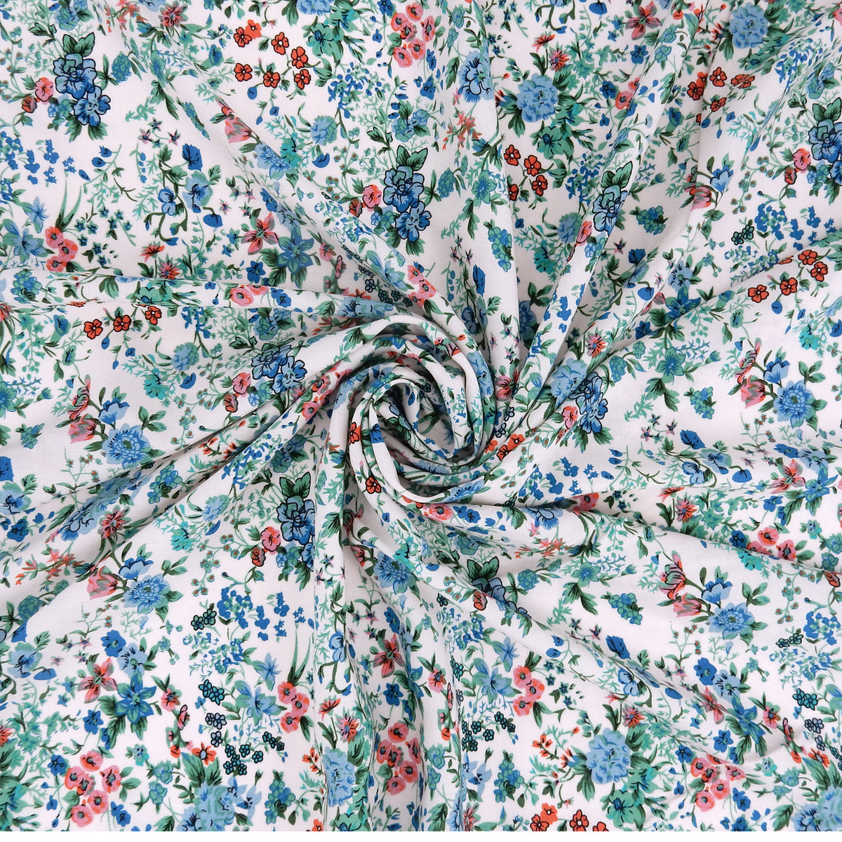 Premium 100% Rayon Challis Fabric. Playful Millefleurs Floral in Sky Blue, Terracotta, Royal Blue on Cream lightweight & ultra soft. shown swirled