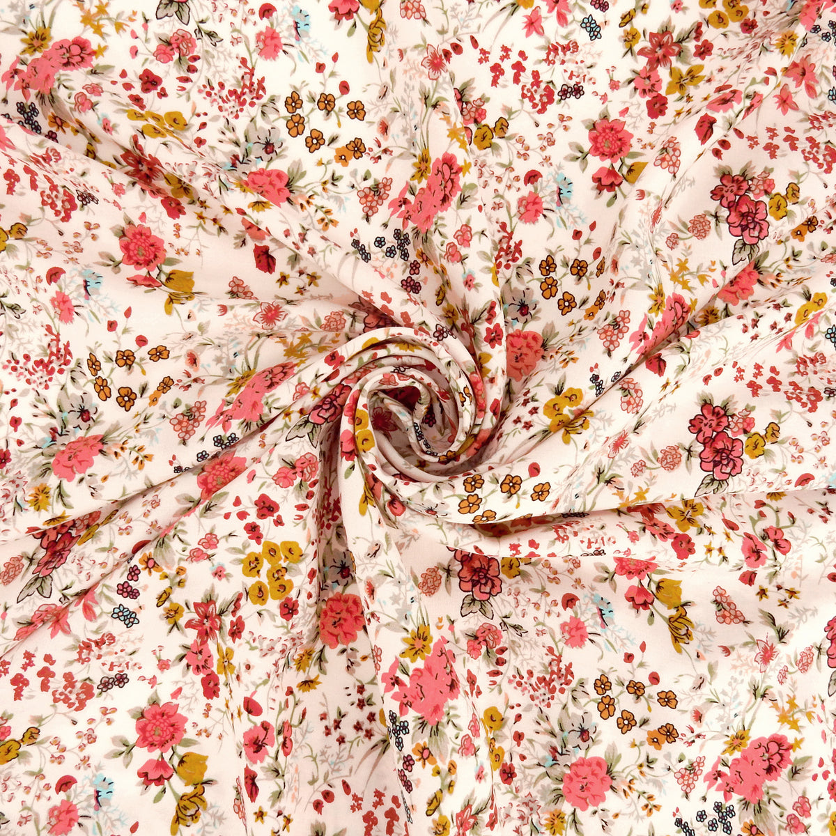 Premium 100% Rayon Challis Fabric. Playful Millefleurs Floral in Red Rose, Gold & Sky Blue on Pale Pink background. lightweight & ultra soft. shown swirled