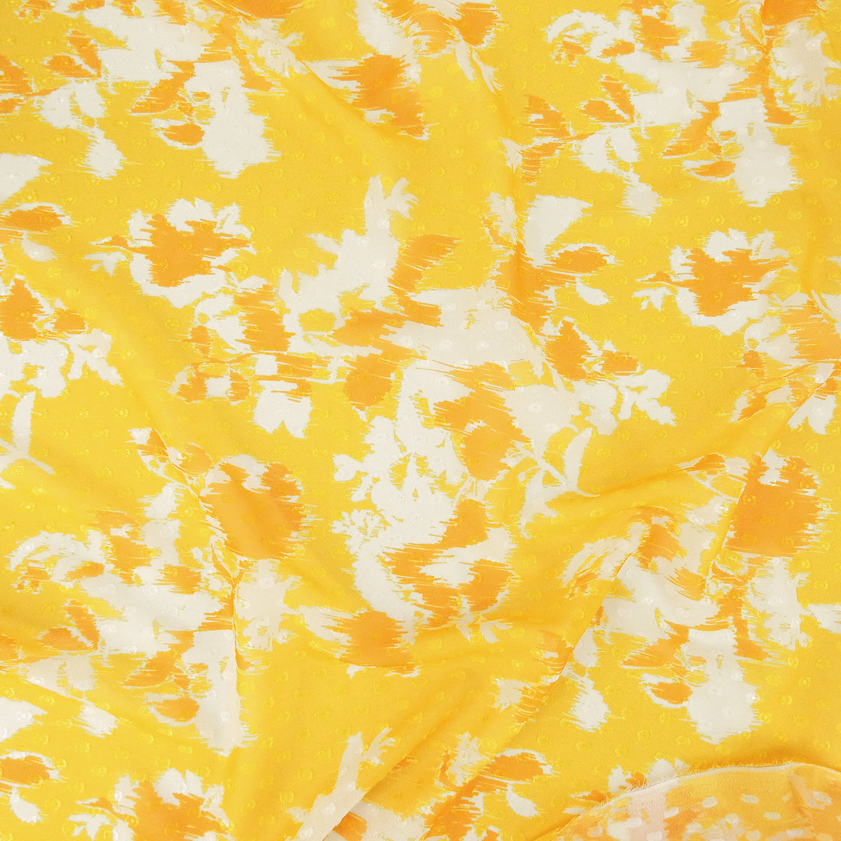 Premium 100% Rayon Challis Fabric. Printed clip dot watercolor in golden yellow, orange & soft cream. Semi-sheer with raised clip dots. shown lightly gathered