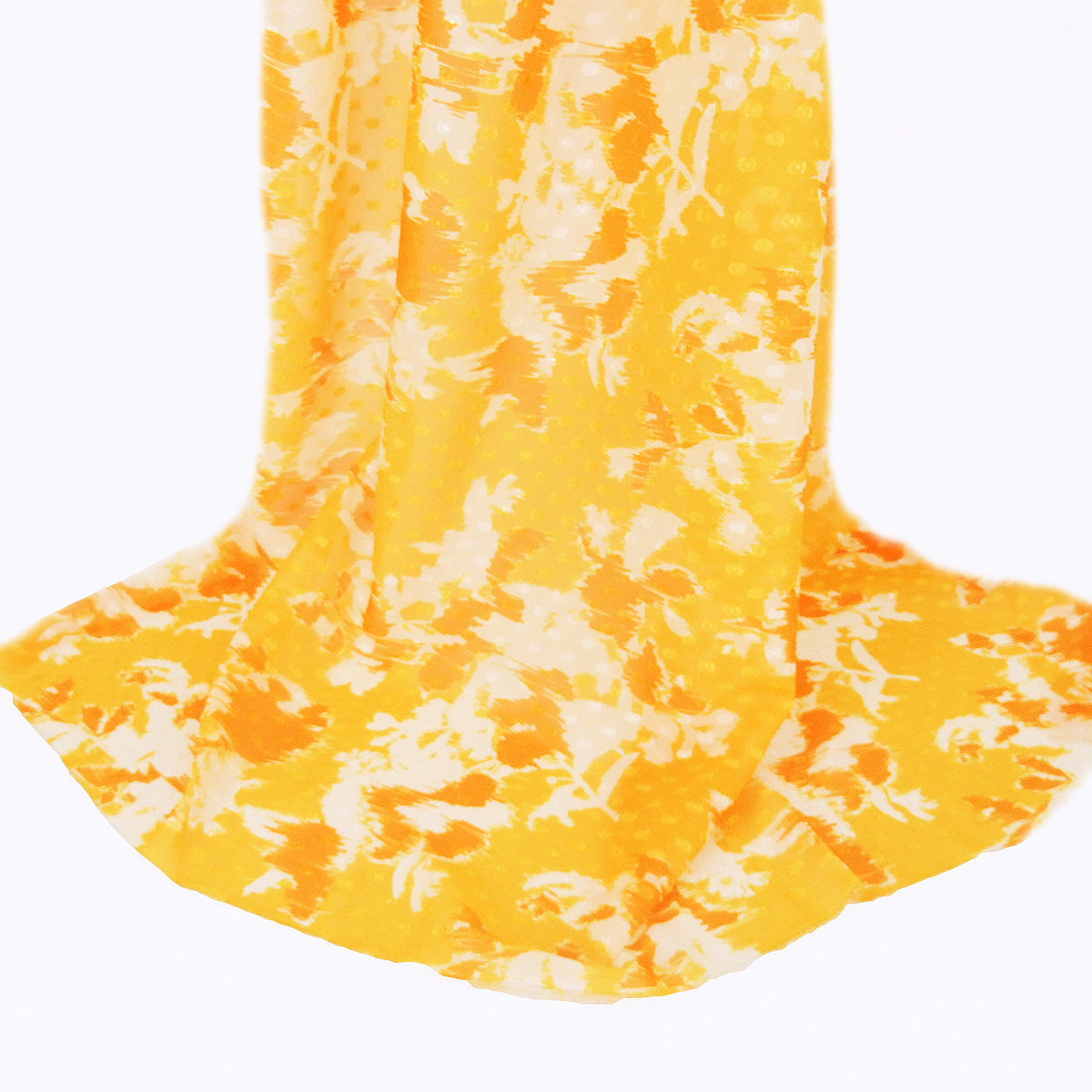 Premium 100% Rayon Challis Fabric. Printed clip dot watercolor in golden yellow, orange & soft cream. Semi-sheer with raised clip dots. shown draped