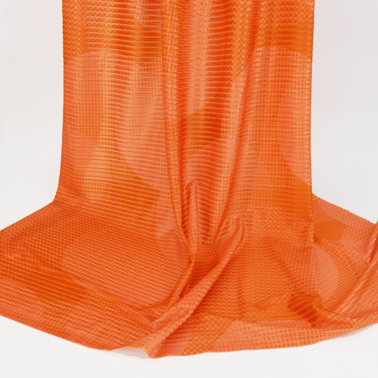 Premium Printed Burnout Stretch Velvet Fabric. Luxury spanish ombre' spice & orange design on polyester spandex horizontal stripe velvet burnout. Shown draped