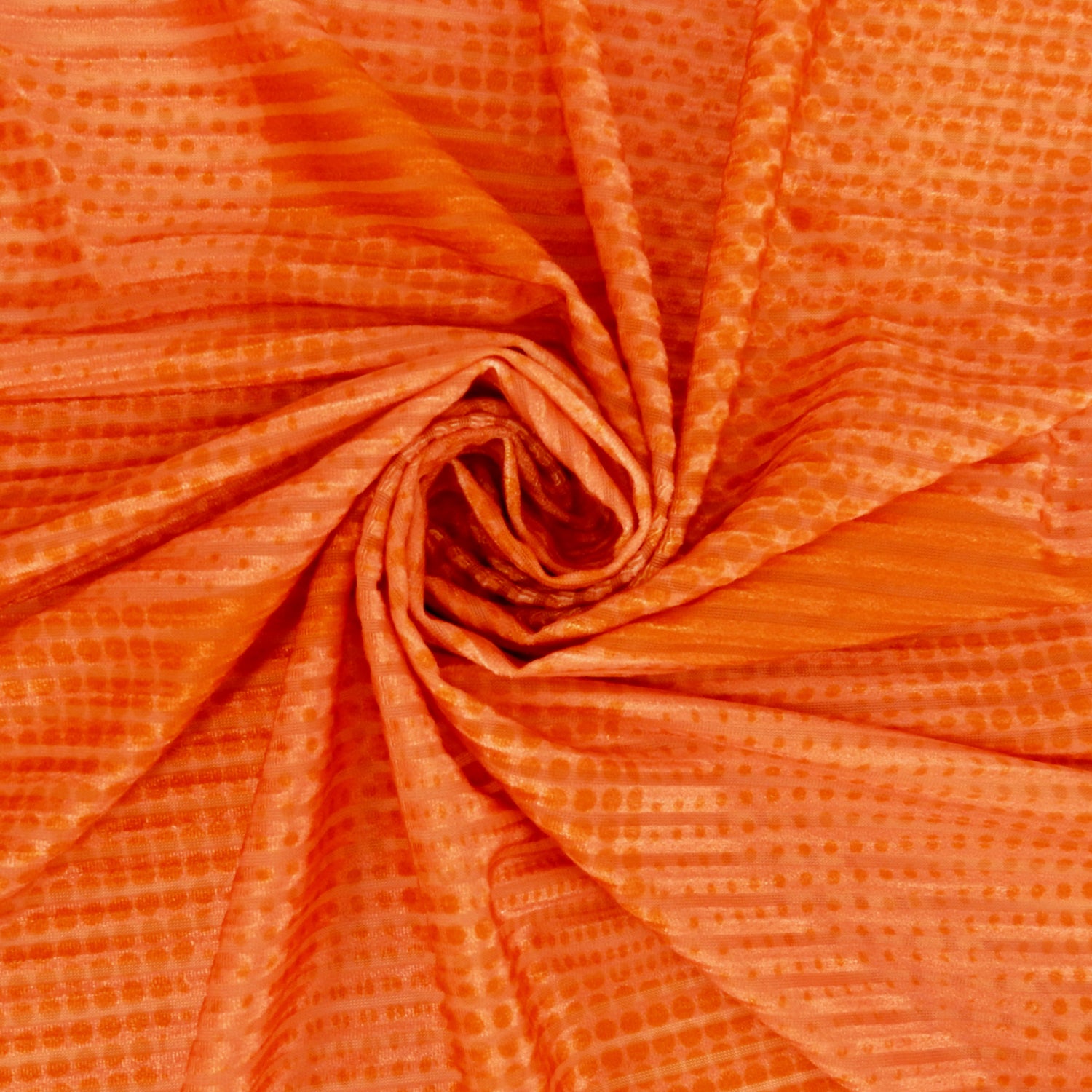 Premium Printed Burnout Stretch Velvet Fabric. Luxury spanish ombre' spice & orange design on polyester spandex horizontal stripe velvet burnout. Shown swirled
